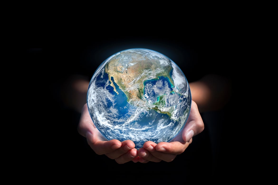 Someone holding a planet